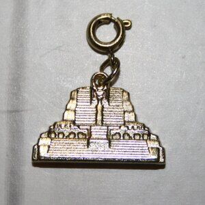 Gold charm from Diamond International 1" tall